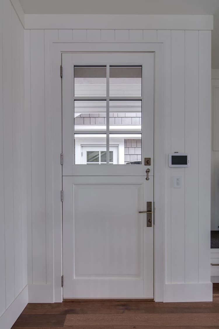 Dutch door with raised panel on bottom, glass lite on top