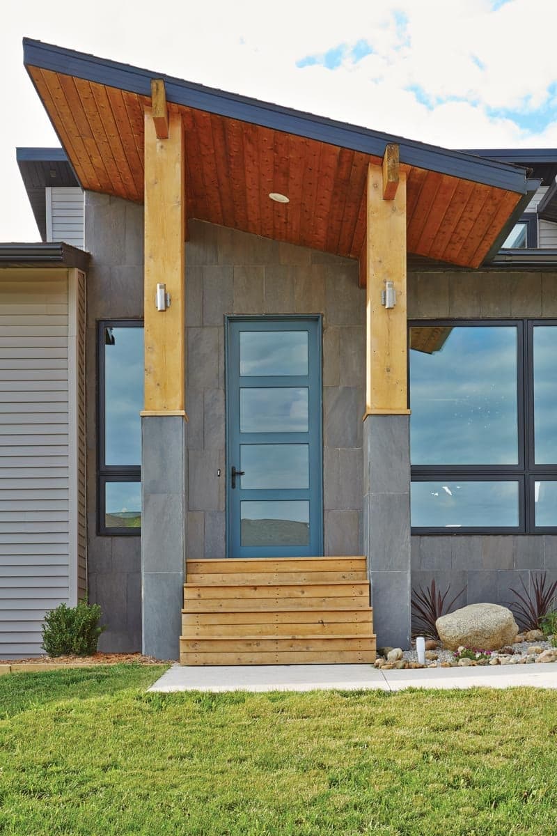 jade-colored swing door offers a unique look